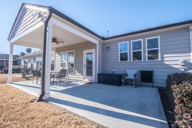 back of property with a patio and ceiling fan