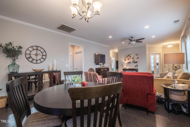 dining area with crown molding, dark hardwood / wood-style floors, and ceiling fan with notable chandelier