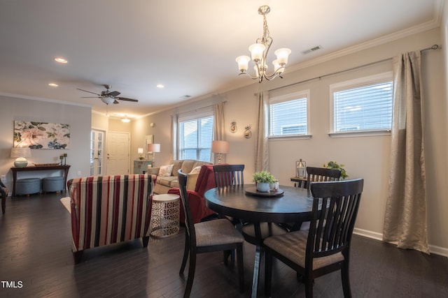 dining space featuring crown molding, dark hardwood / wood-style floors, and ceiling fan with notable chandelier