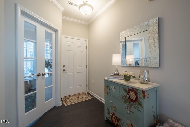 foyer with crown molding, dark wood-type flooring, and french doors