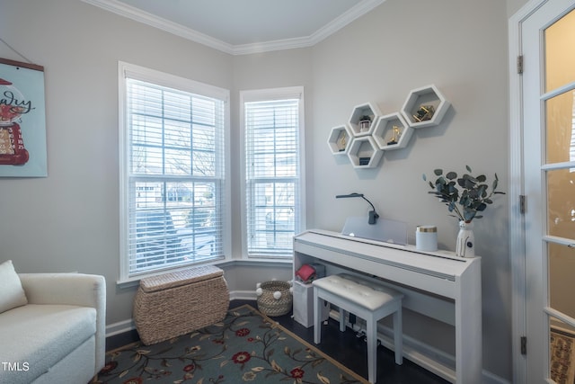 living area with crown molding and a wealth of natural light