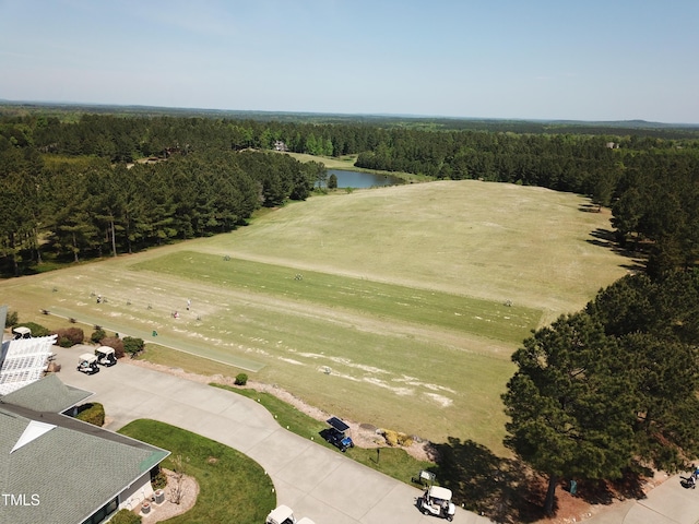 birds eye view of property featuring a water view and a forest view