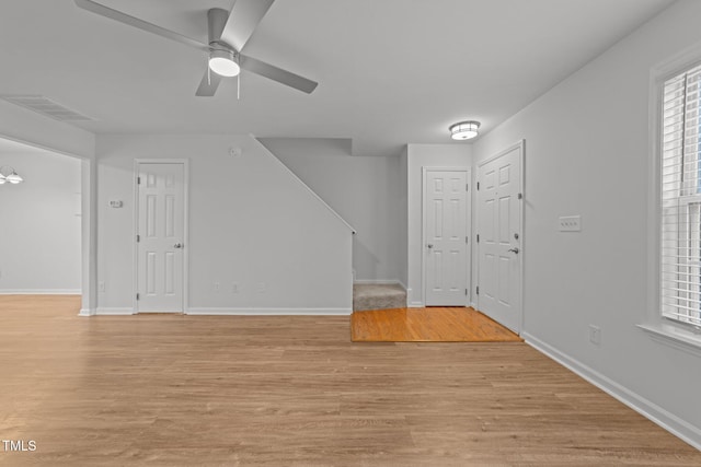 interior space with light hardwood / wood-style floors and ceiling fan