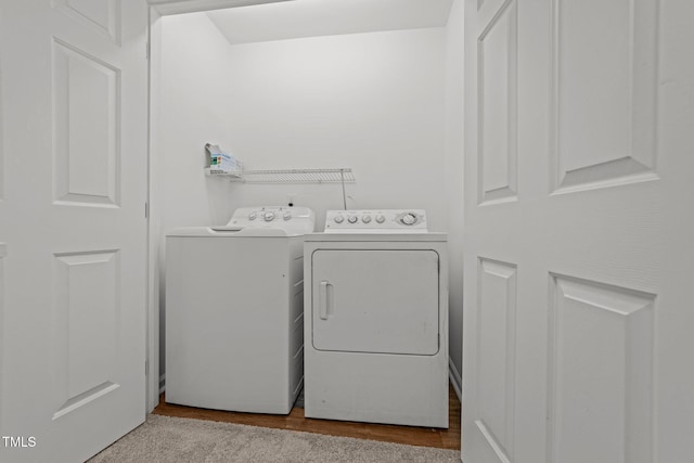 washroom with washer and clothes dryer