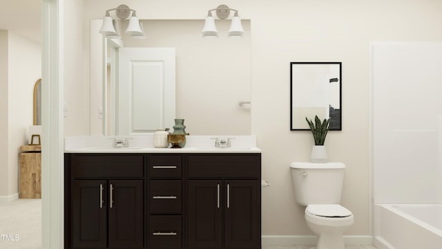 bathroom featuring toilet and vanity