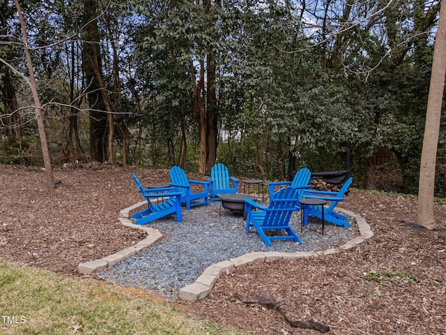 view of playground featuring an outdoor fire pit