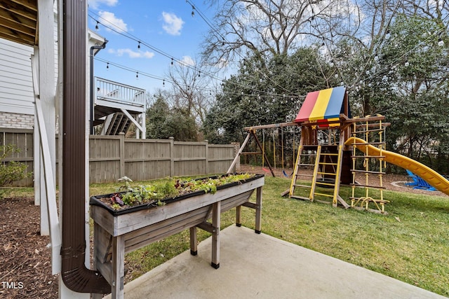 view of play area with a yard and a patio area