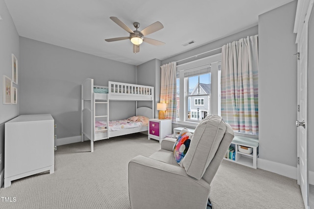 bedroom with light carpet and ceiling fan