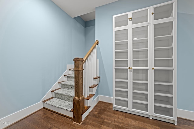 stairway featuring hardwood / wood-style flooring