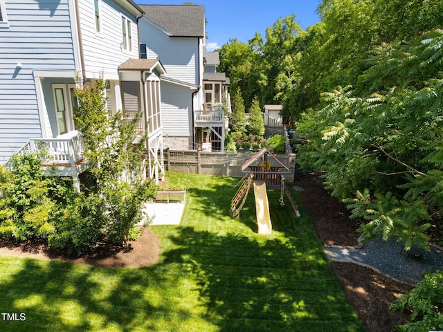 1000 Norris St, Raleigh, NC 27604 - view of green lawn with a playground and a vegetable garden
