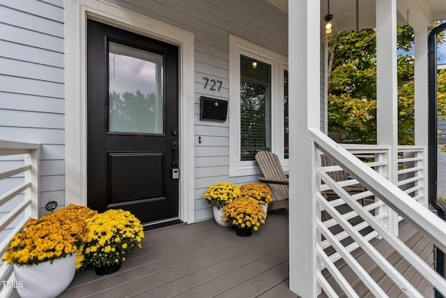 property entrance with covered porch