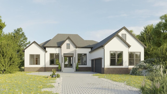 modern farmhouse featuring a garage and a front yard