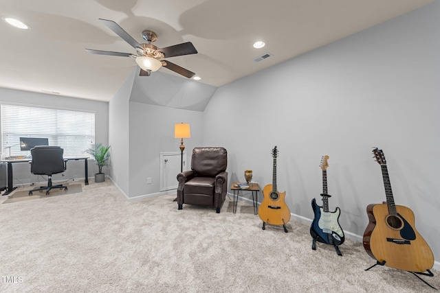 sitting room featuring ceiling fan, light colored carpet, and vaulted ceiling