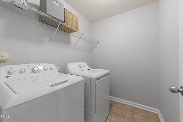 laundry area featuring washing machine and clothes dryer