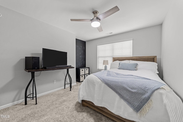 bedroom with ceiling fan and light colored carpet