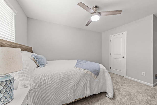 bedroom featuring light carpet and ceiling fan