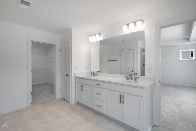 1264 Hardin Hill Ln, Knightdale, NC 27545 - bathroom featuring double vanity, a stall shower, and a walk in closet