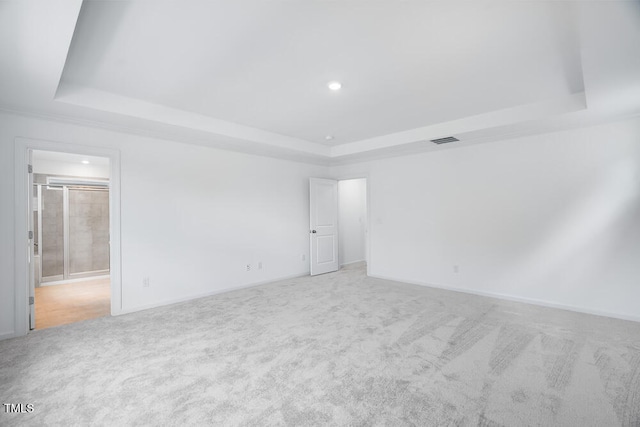 1264 Hardin Hill Ln, Knightdale, NC 27545 - empty room with a tray ceiling, light colored carpet, and recessed lighting