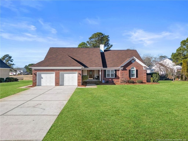 view of front of house featuring a front yard and a garage