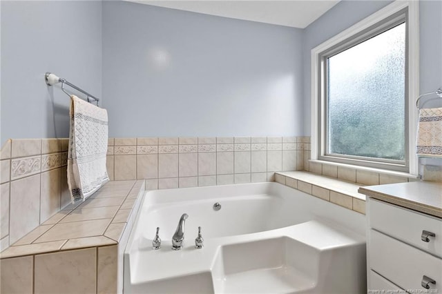 bathroom featuring vanity and a washtub