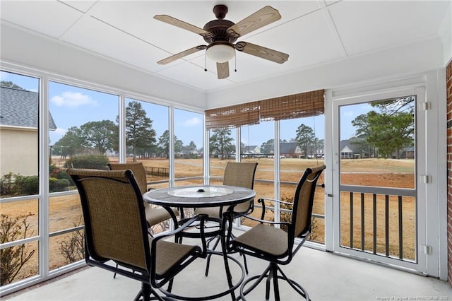 sunroom with ceiling fan and plenty of natural light