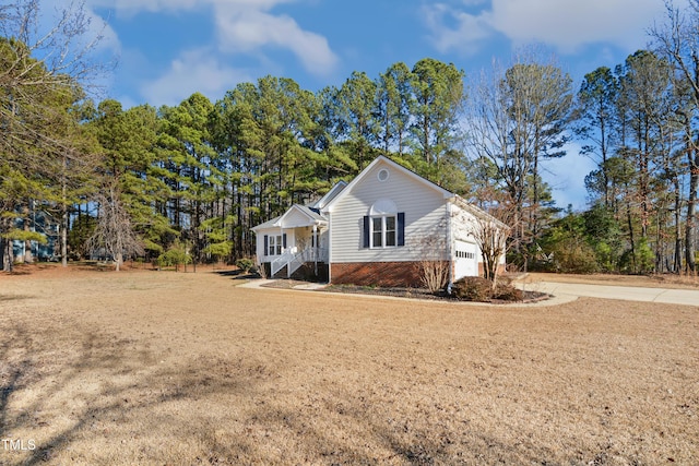 view of property exterior with a lawn