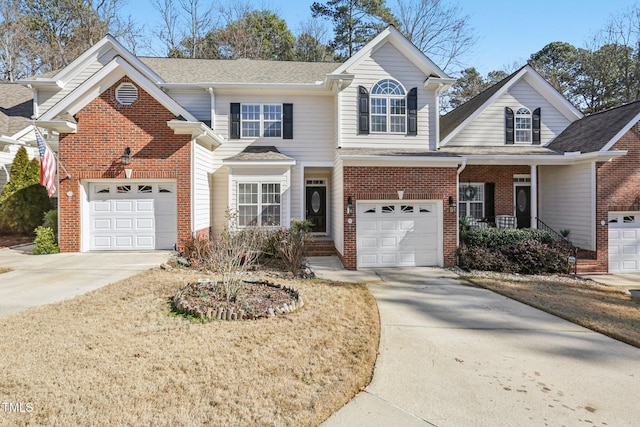 front facade with a garage and covered porch