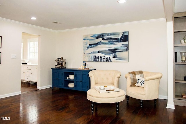 living area with dark hardwood / wood-style flooring and ornamental molding