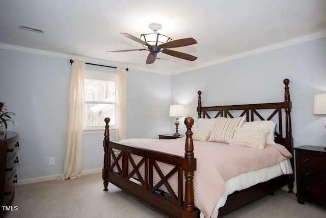 bedroom featuring ornamental molding, light colored carpet, and ceiling fan