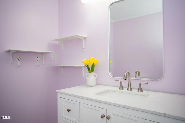 bathroom featuring vanity and crown molding