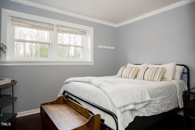 bedroom with crown molding and dark wood-type flooring