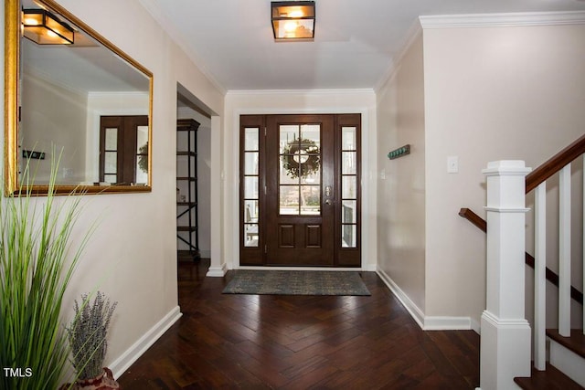 foyer with ornamental molding and dark hardwood / wood-style floors