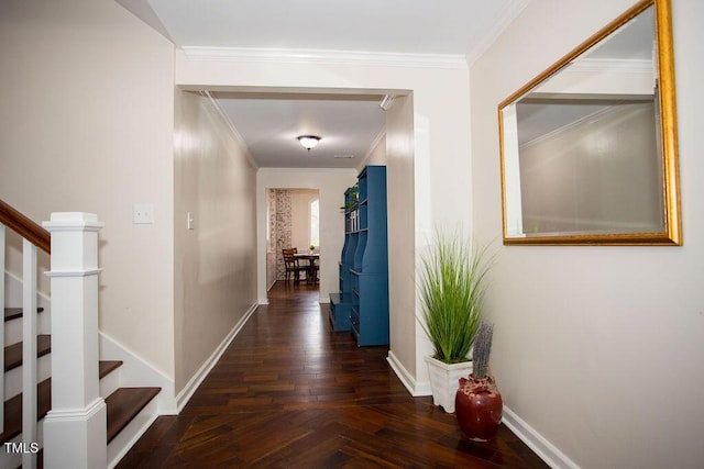 hall with ornamental molding and dark parquet flooring