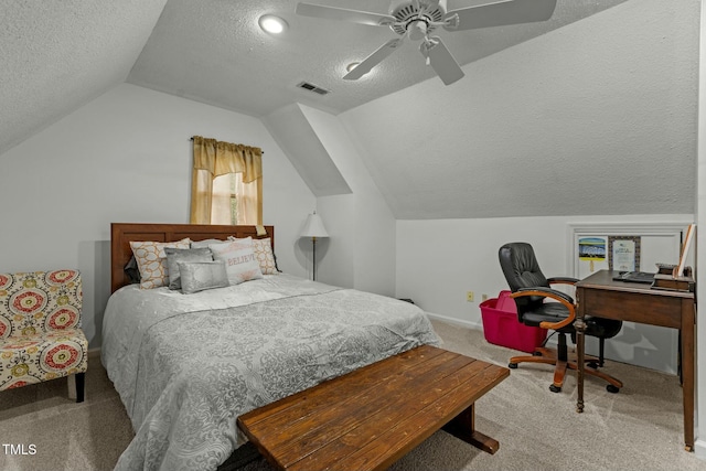 bedroom with ceiling fan, light colored carpet, lofted ceiling, and a textured ceiling