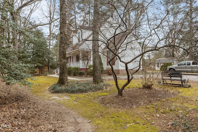 view of yard featuring a porch