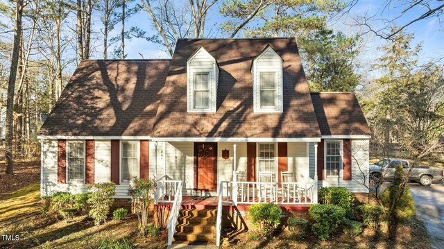 cape cod house with a porch