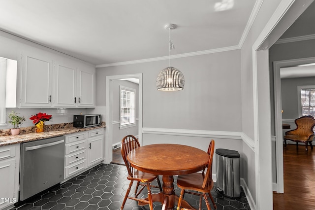 tiled dining area with ornamental molding and a healthy amount of sunlight