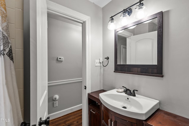 bathroom with hardwood / wood-style flooring and vanity