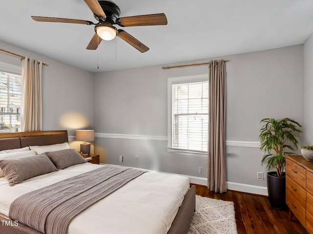 bedroom featuring ceiling fan and dark hardwood / wood-style floors