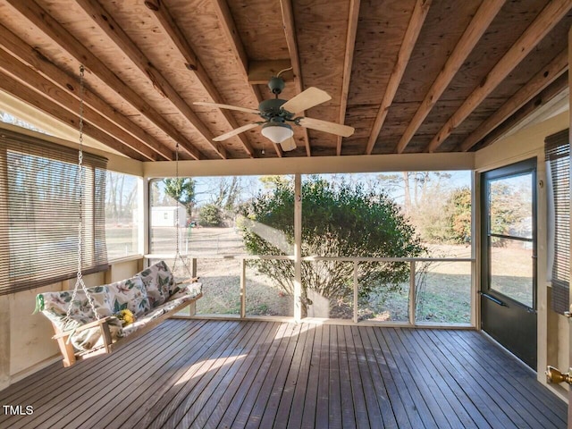 unfurnished sunroom with lofted ceiling and ceiling fan