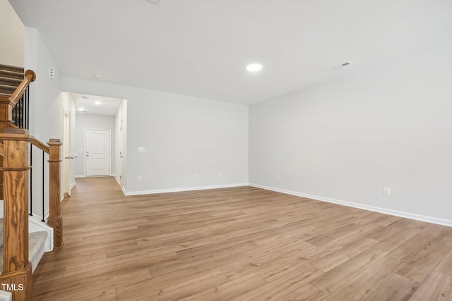 spare room with light hardwood / wood-style floors