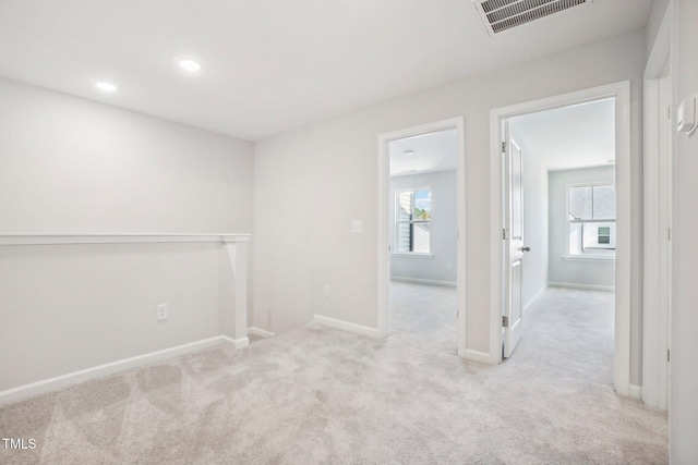 carpeted empty room with plenty of natural light