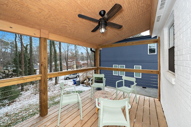 snow covered deck featuring ceiling fan