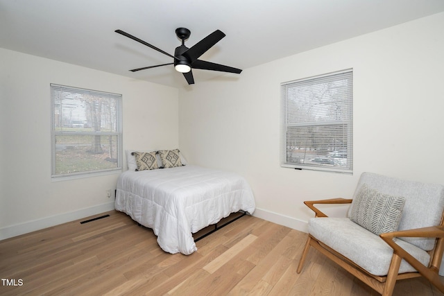 bedroom with wood-type flooring and ceiling fan