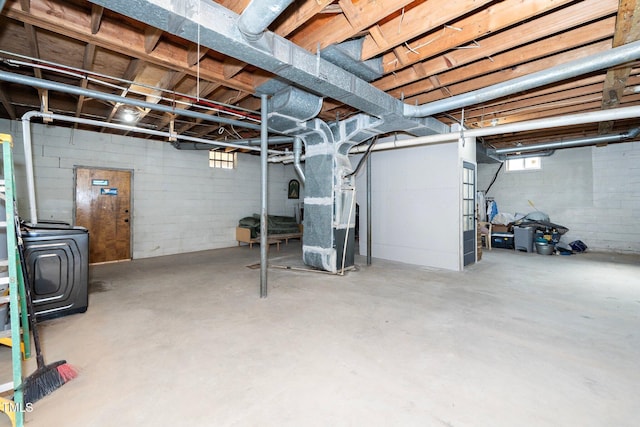 basement with washer / dryer and heating unit