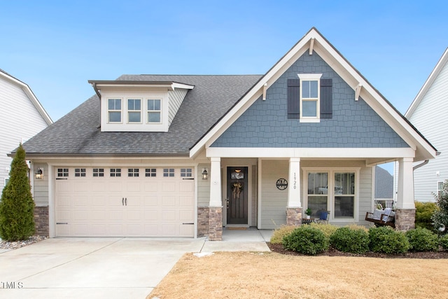 craftsman-style house with a porch and a garage