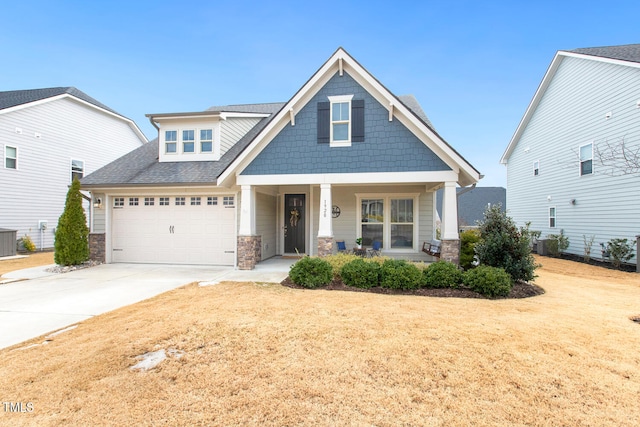 craftsman-style house featuring central AC and a porch