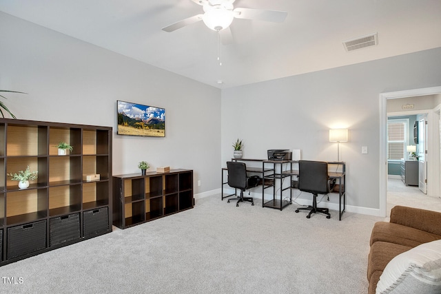 carpeted office featuring ceiling fan