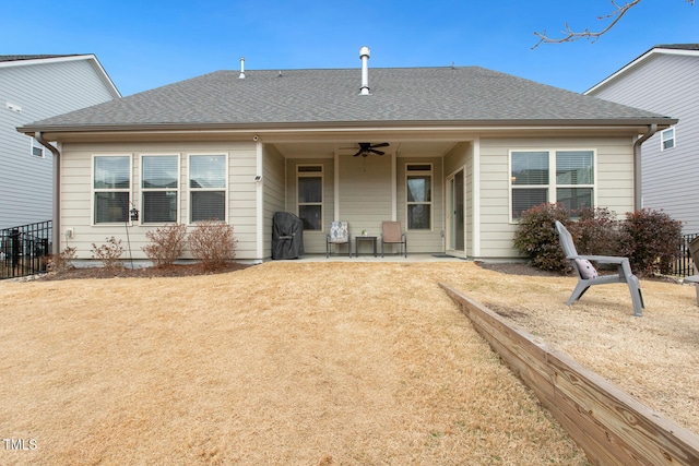 back of property with a patio area, ceiling fan, and a lawn