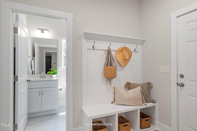 mudroom with a sink